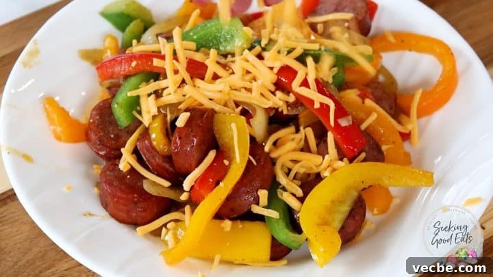 Authentic Cajun Sausage and Peppers Recipe 4 Serving and topping sausage and peppers with cheese