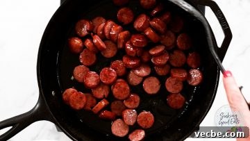 Authentic Cajun Sausage and Peppers Recipe 6 Cooking smoked sausage in a cast iron skillet