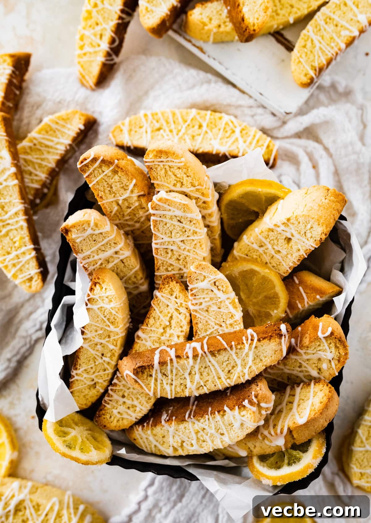 65+ Christmas Dessert Recipes Your Guests Will Love 13 basket of biscotti cookies with lemon drizzle.