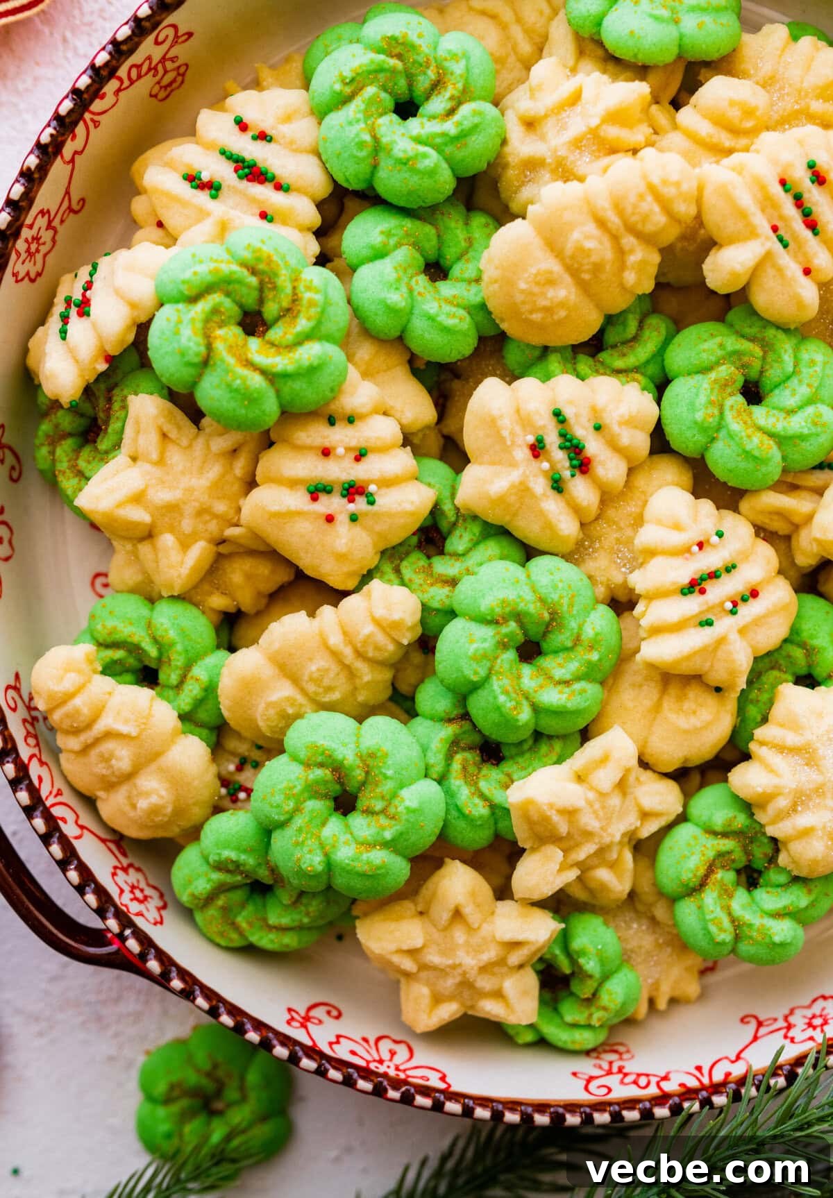 65+ Christmas Dessert Recipes Your Guests Will Love 15 All the decorated spritz cookies on a beautiful festive cookie platter ready to serve.