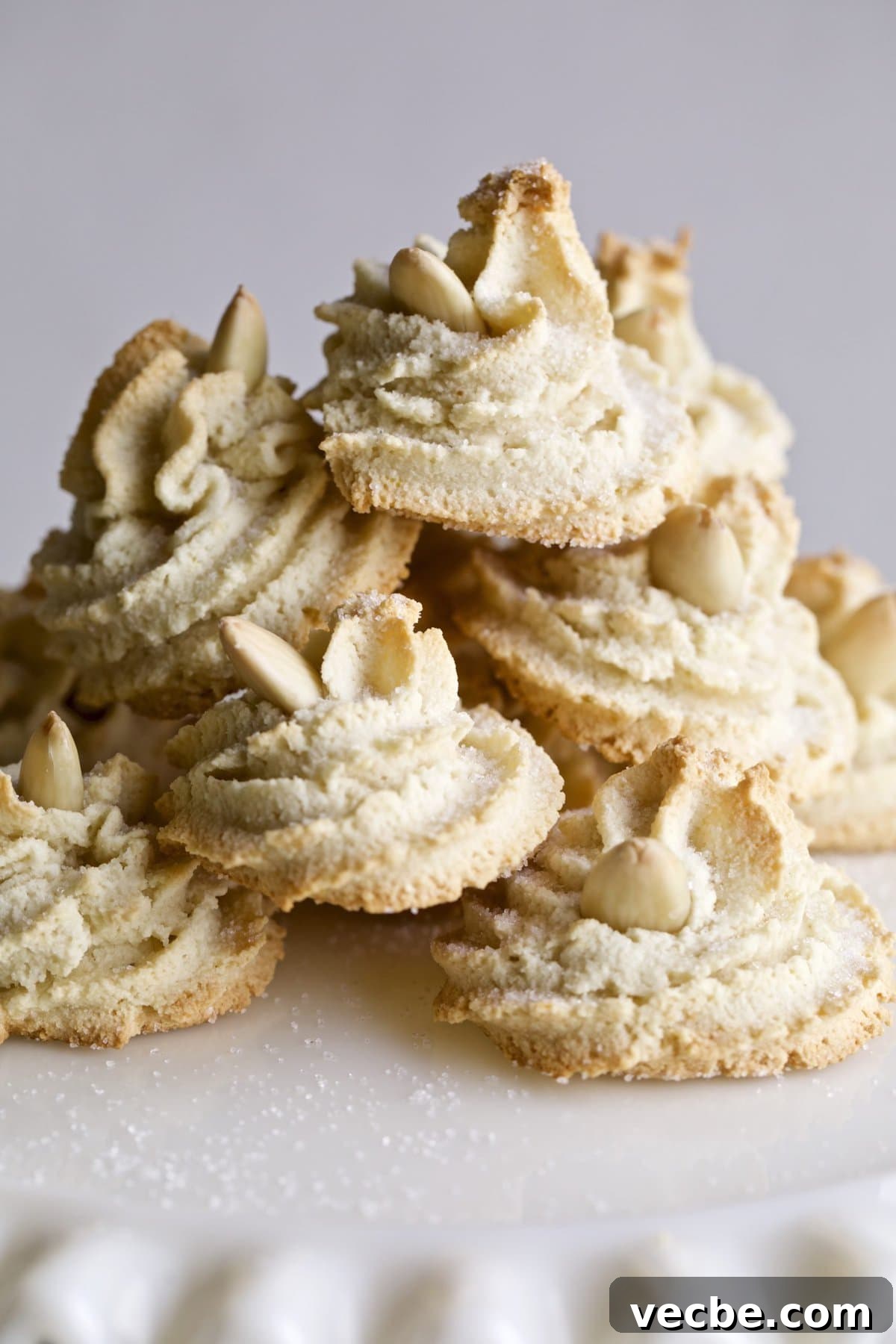 65+ Christmas Dessert Recipes Your Guests Will Love 10 Soft Amaretti Cookies Italian Almond Cookies on a cake plate