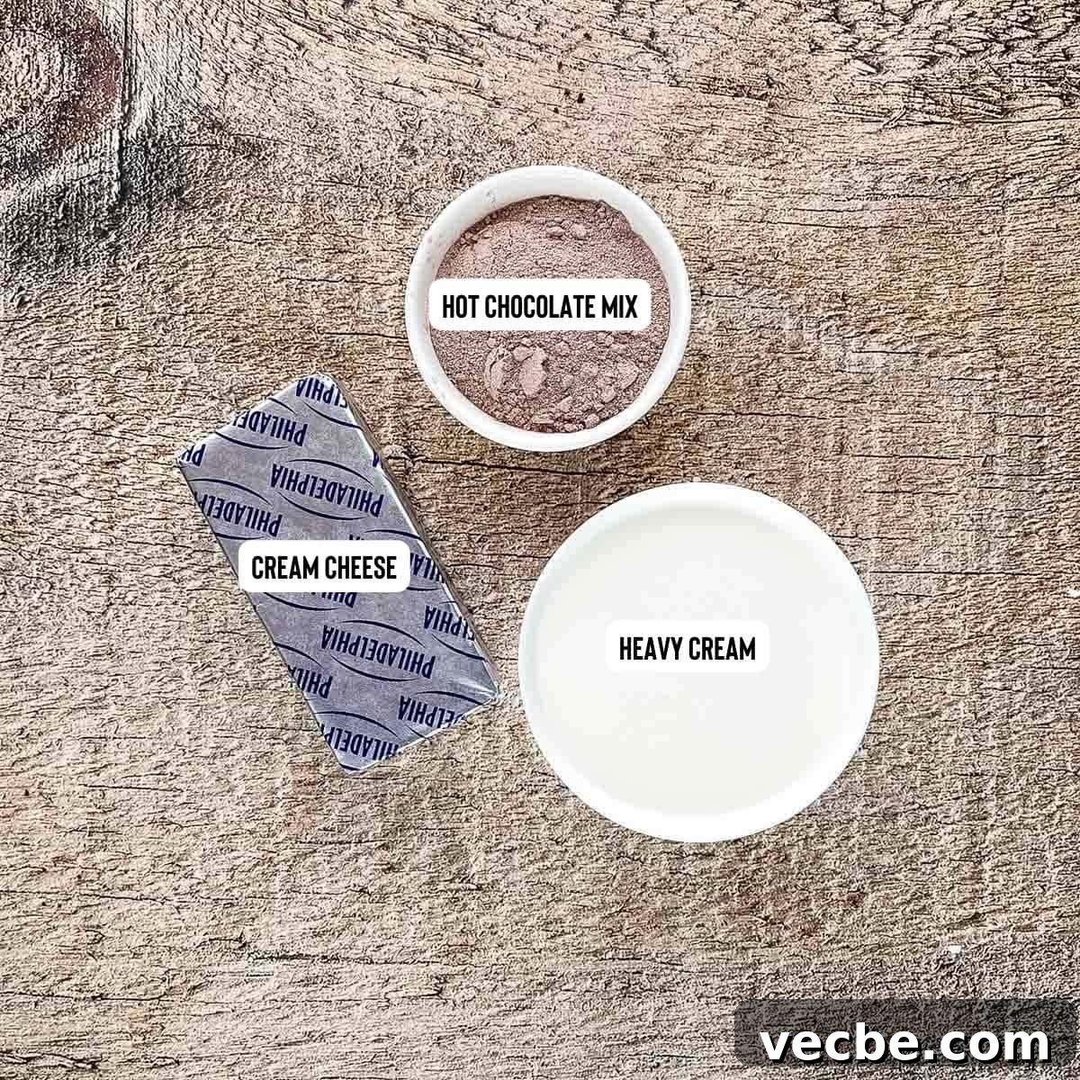 3 Ingredient Hot Cocoa Dip Without Marshmallow Fluff 3 Ingredients for 3 ingredient hot cocoa dip on a brown table.