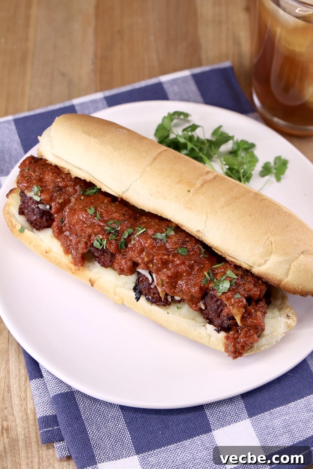 Meatball Marinara Sub Sandwiches - grilled Meatball Sub with Marinara on a white plate