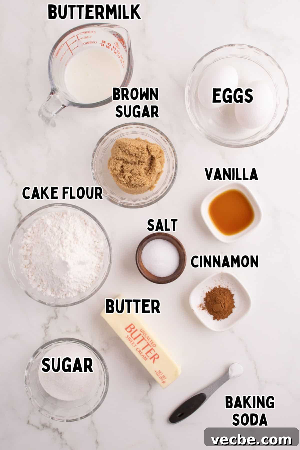 Crumb Cake Recipe with Cinnamon Streusel Topping 4 Labelled ingredients for crumb cake recipe on marble board.