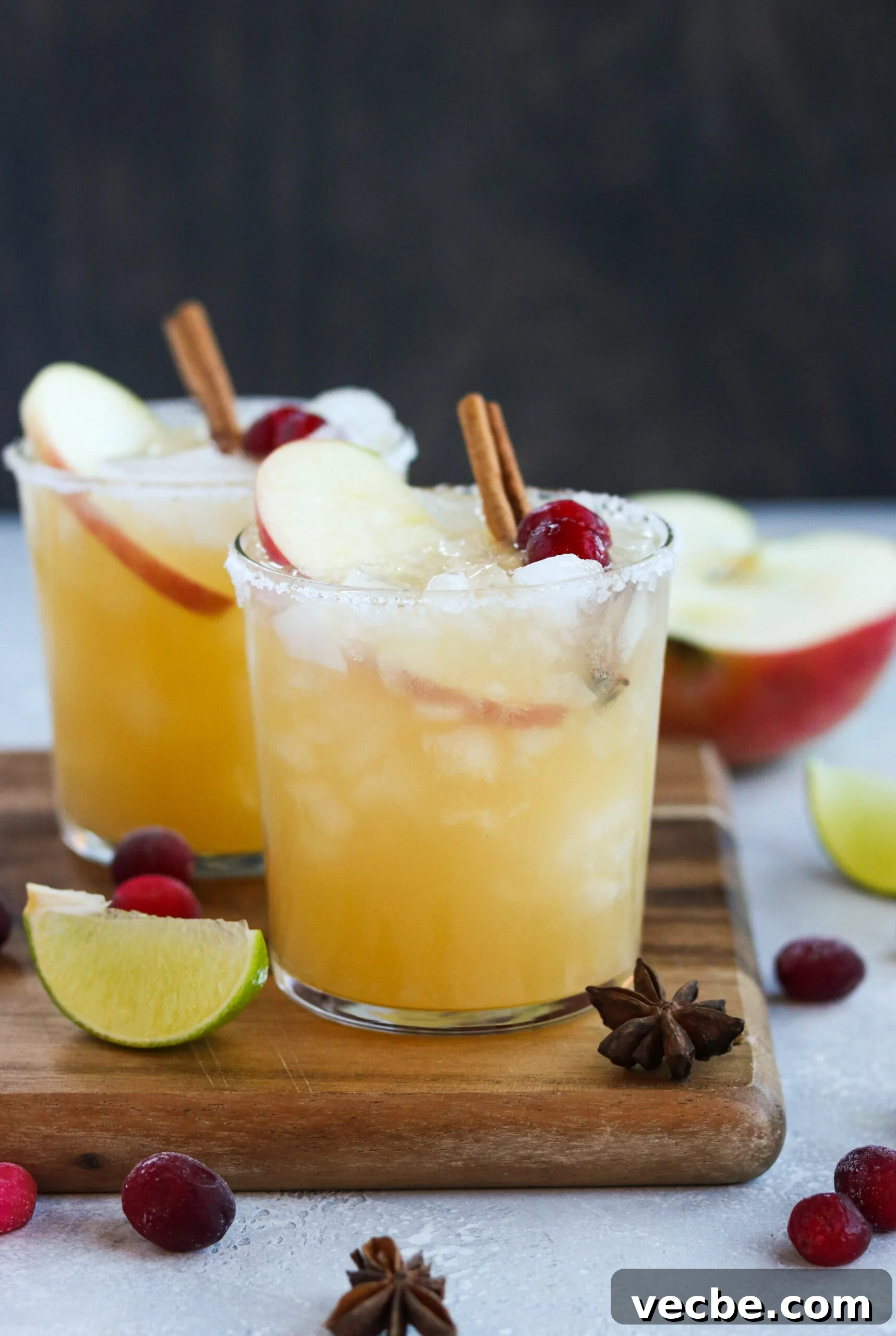 Apple Cider Margarita Recipe with Cinnamon for Fall 4 two thanksgiving cocktails on a wooden cutting board