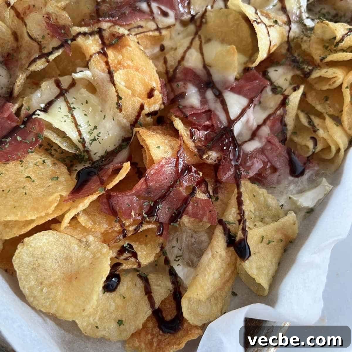 Loaded Charcuterie Nachos Appetizer 2 Charcuterie nachos drizzled with balsamic glaze.