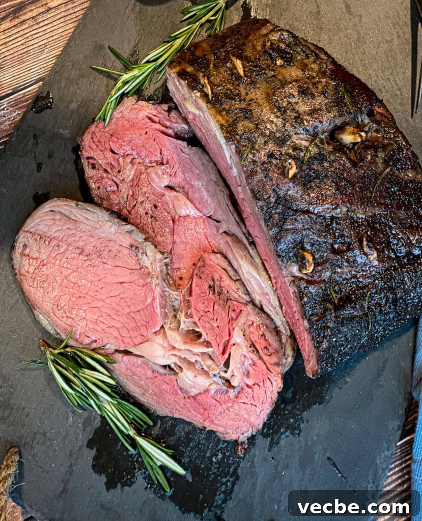 How to Smoke and Sear Prime Rib Roast 7 overhead view of a sliced smoked prime rib