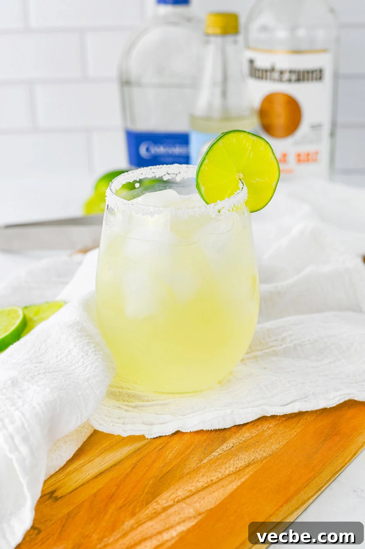 Authentic Lime Margarita Recipe with Fresh Lime Juice 7 Lime Margarita finished in glass with white linen