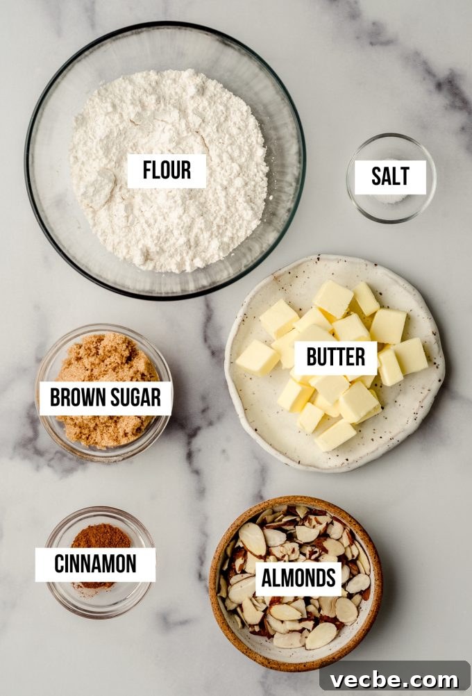 Peach Almond Streusel Muffins with Crumb Topping 5 Aerial photo of ingredients to make almond streusel muffins with text overlay labeling each ingredient.