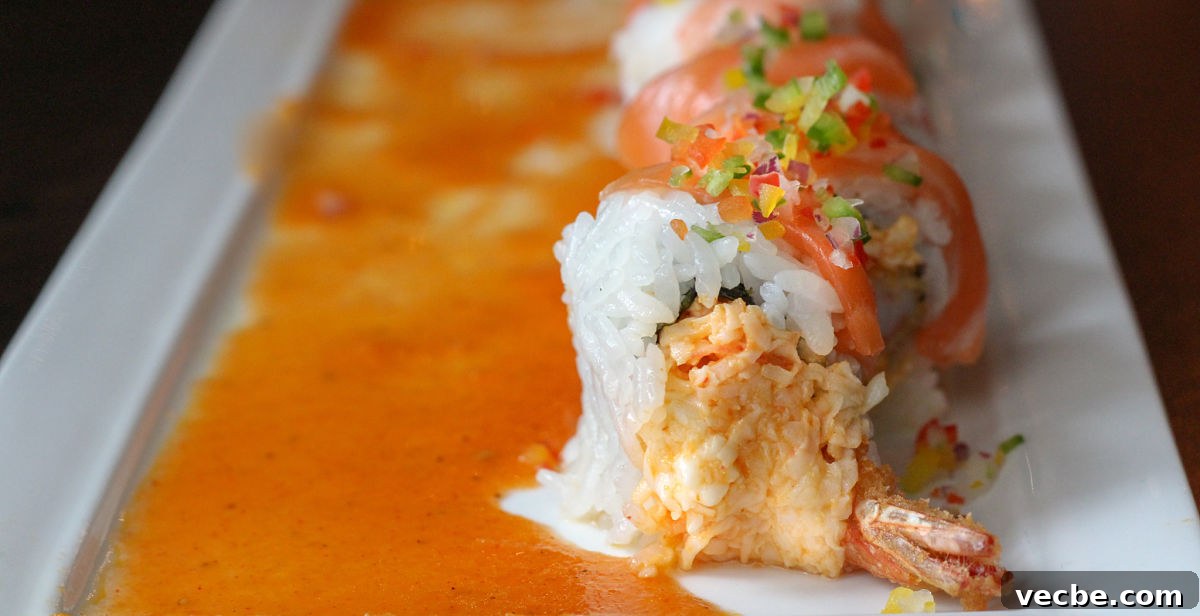 Edoko Sushi Richardson Review with Menu Highlights 8 ocean beauty sushi roll on plate with sauce at Edoko restaurant in Richardson, TX - photo by Kelly Kirkendoll