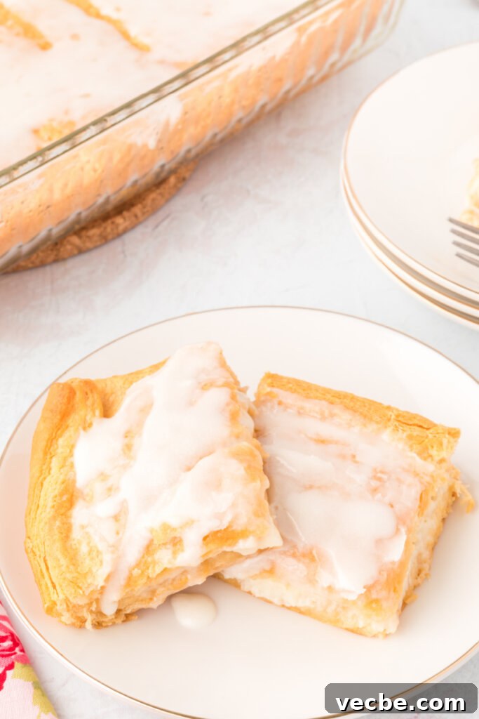 Flaky Cheese Danish Recipe 3 two cheese danish squares on a white plate