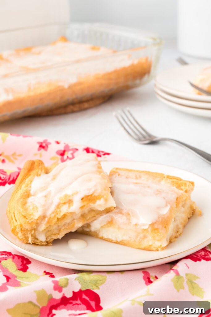 Flaky Cheese Danish Recipe 4 cheese danishes on plate on pink flowery towel