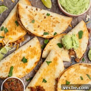 Crispy Baked Bean and Cheese Tacos with Avocado Crema 12 This is a square picture of baked bean and cheese tacos.