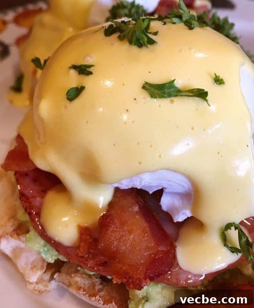 Eggs Benedict Recipe: Poached Eggs and Hollandaise 8 Holandaise sauce poured over Eggs Benedict
