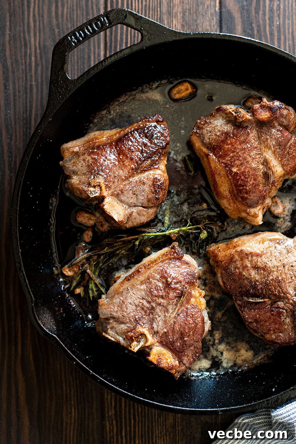 Pan-Seared Lamb Loin Chops with Cognac Butter Recipe 2 Perfectly seared lamb loin chops in a cast iron skillet with cognac butter, fresh herbs, and garlic.