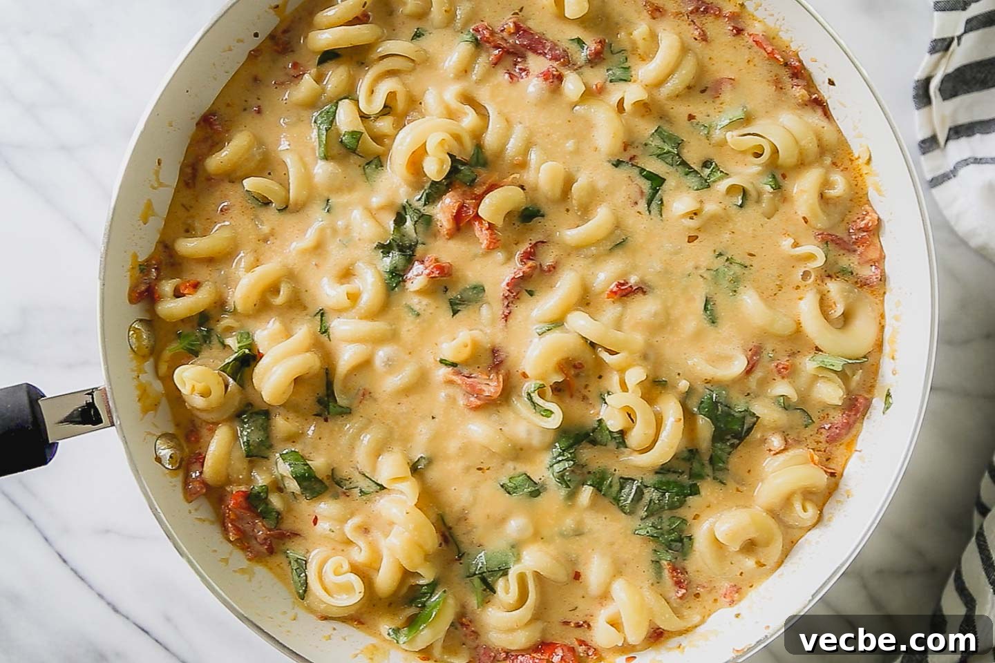 Creamy Sun-Dried Tomato and Basil Pasta Recipe 2 Sun-dried tomato and basil pasta in a skillet.