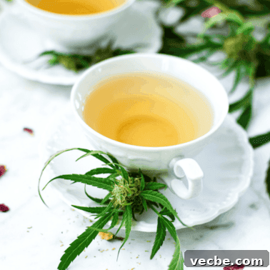 CBN for Sleep: Benefits, Dosage, and Safety 13 A white teacup full of cannabis tea with a cannabis plant