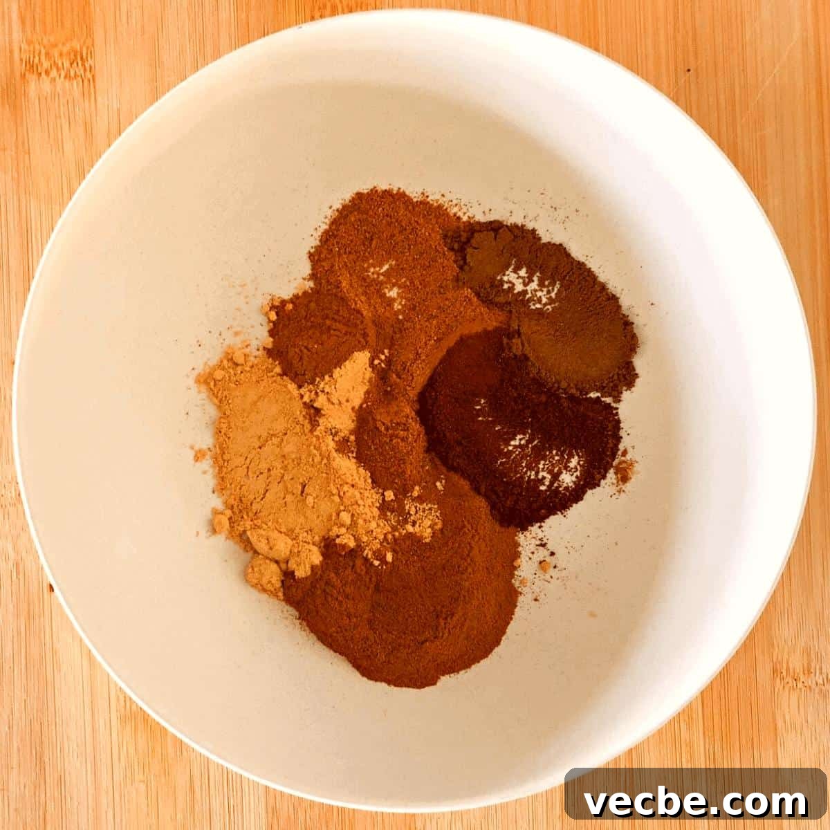 Pumpkin Pie Spice Recipe: Make 1 Tablespoon at Home 4 The ingredients to make pumpkin pie spice in a white bowl.