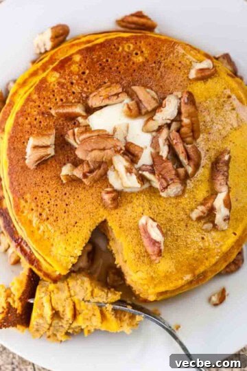 Pumpkin Pie Spice Recipe: Make 1 Tablespoon at Home 10 A stack of pumpkin pancakes topped with chopped pecans.