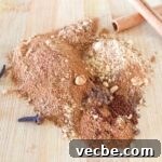 Pumpkin Pie Spice Recipe: Make 1 Tablespoon at Home 6 Spices for homemade pumpkin pie spice recipe on a wooden cutting board with cinnamon sticks and whole cloves.