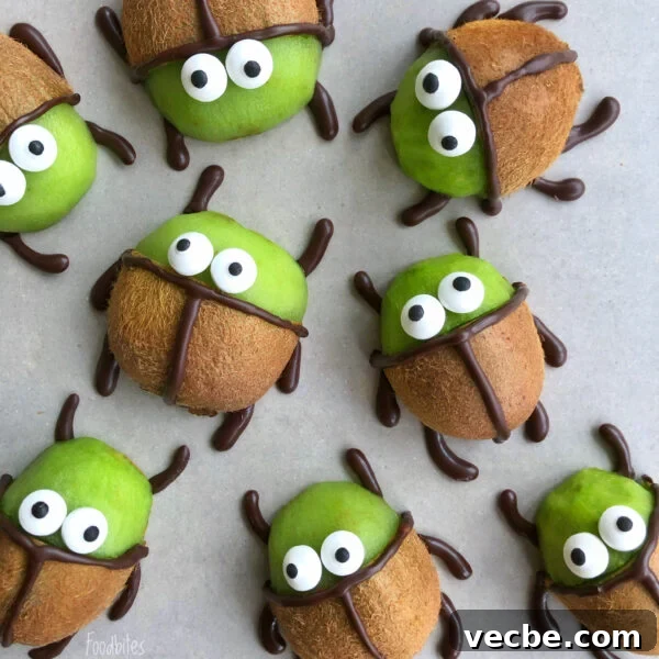 How to Make Chocolate Butterflies for Desserts 7 Beetlejuice Kiwis decorated with chocolate and candy eyes to resemble cartoon beetles.