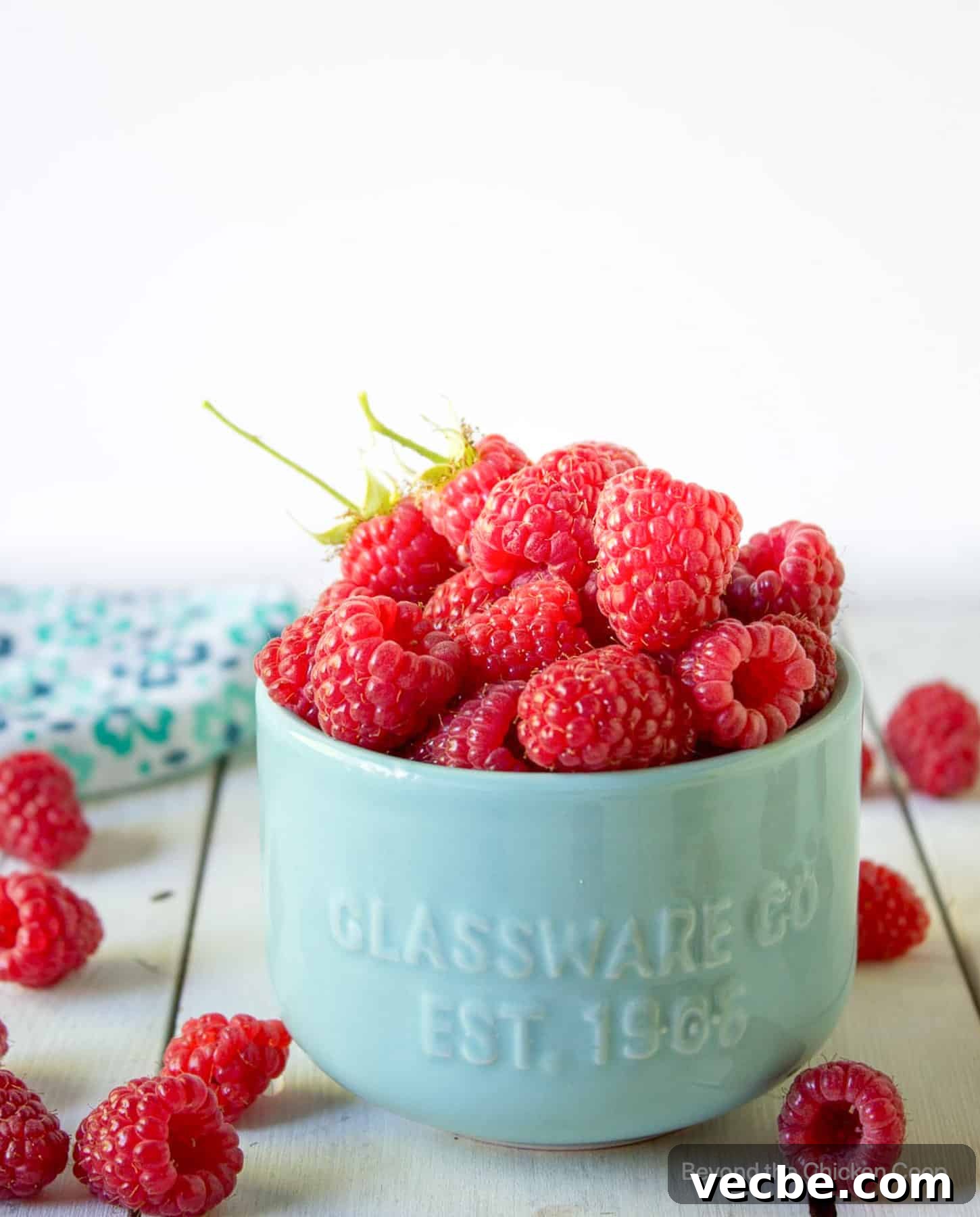 Homemade Raspberry Sweet Rolls Recipe 3 A small bowl filled with fresh raspberries.