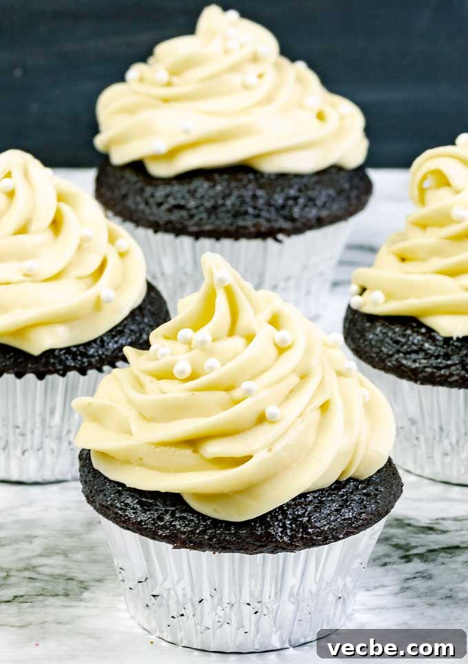 Guinness Dark Chocolate Cupcakes with Irish Cream Frosting 2 four Guinness Dark Chocolate Cupcakes with Irish Cream Cream Cheese Frosting in silver wrappers