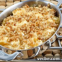 A baking dish with rutabaga gratin with breadcrumb topping and cheese.