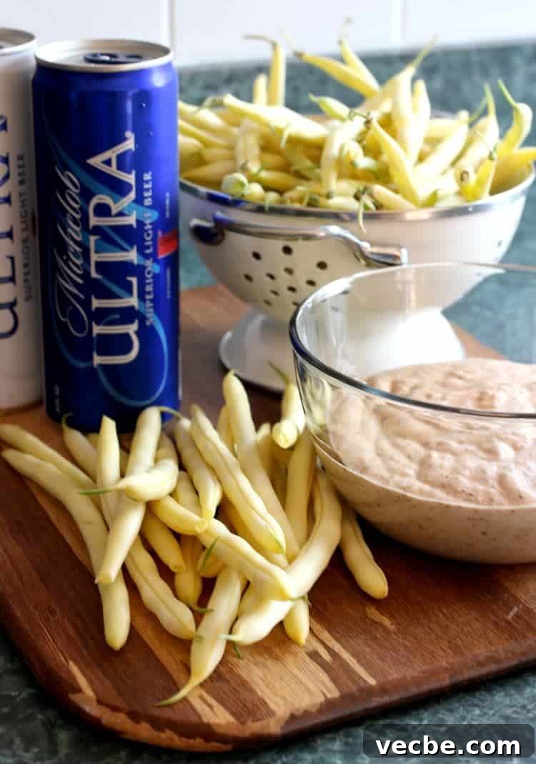 Fresh green beans coated in a simple light beer batter before frying. Beer Battered Green Beans process