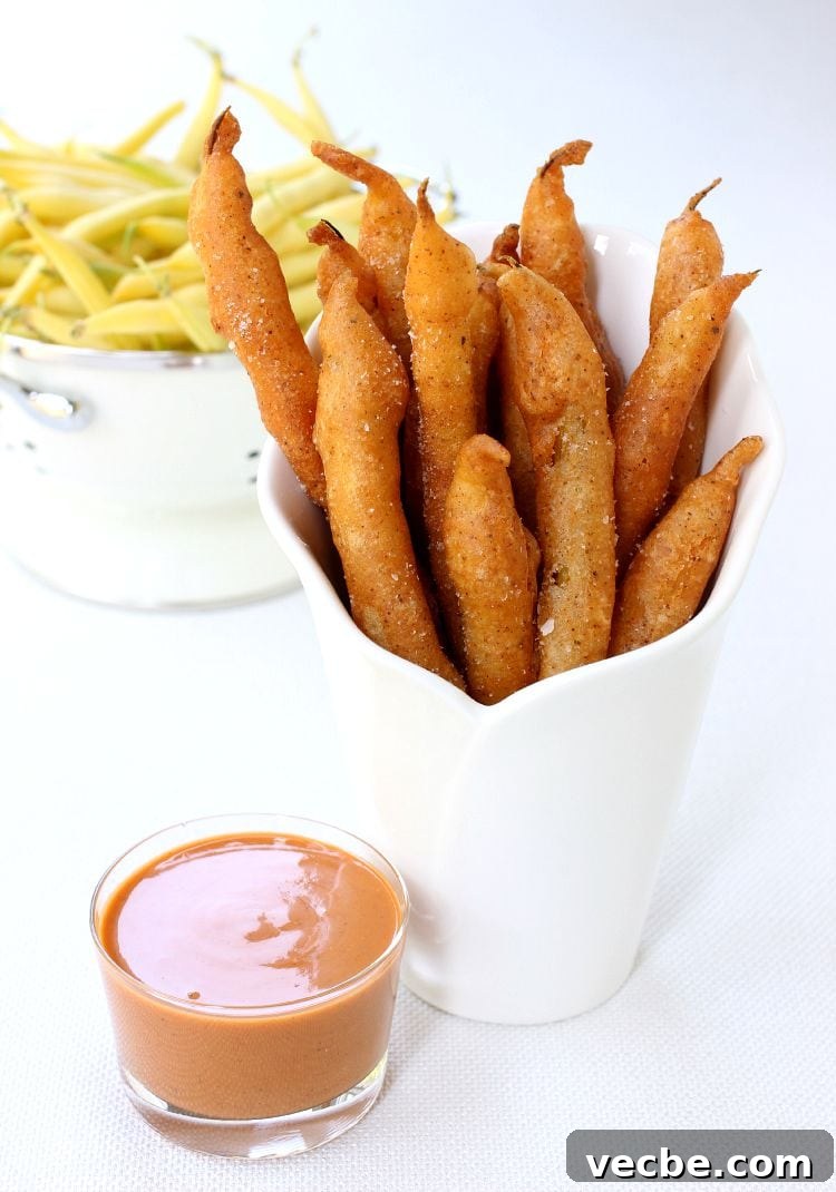 Crispy Beer Battered Green Beans served with creamy barbecue dipping sauce. Beer Battered Green Beans featured