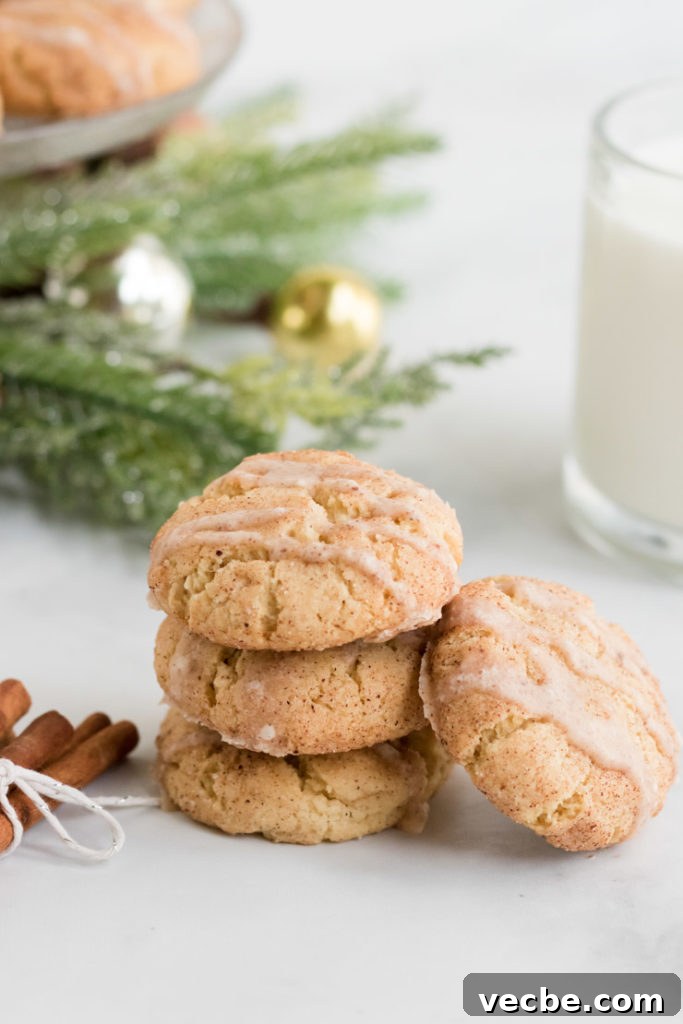 Soft Eggnog Cookies with Warm Holiday Spices 14 A stack of eggnog cookies with a glass of milk in the background.