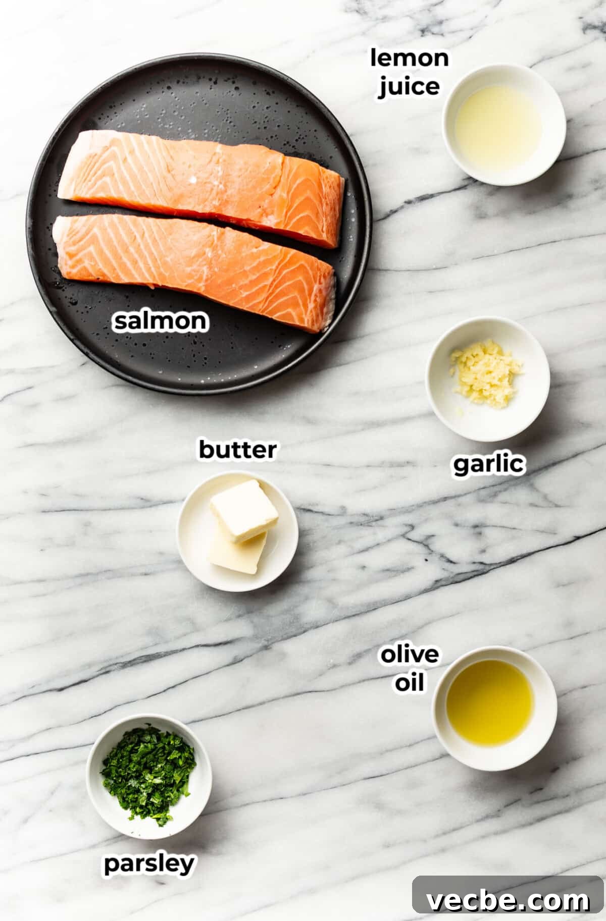Pan-Seared Garlic Butter Salmon Bites Recipe 3 ingredients for garlic butter salmon bites in prep bowls