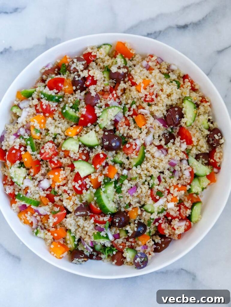 Mediterranean Quinoa Salad with Feta and Chickpeas 5 All ingredients of the Mediterranean quinoa salad mixed together in a bowl