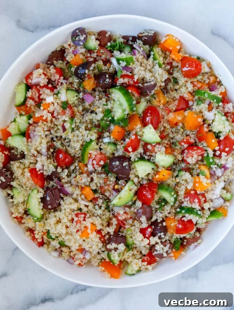 Mediterranean Quinoa Salad with Feta and Chickpeas 6 Top view of Mediterranean quinoa salad after pouring the dressing