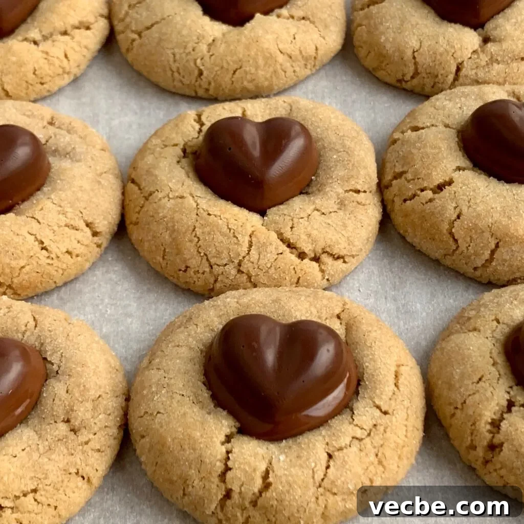 Romantic Valentine's Day Recipes for Two 12 Several round peanut butter cookies with a chocolate heart pushed down in the middle.