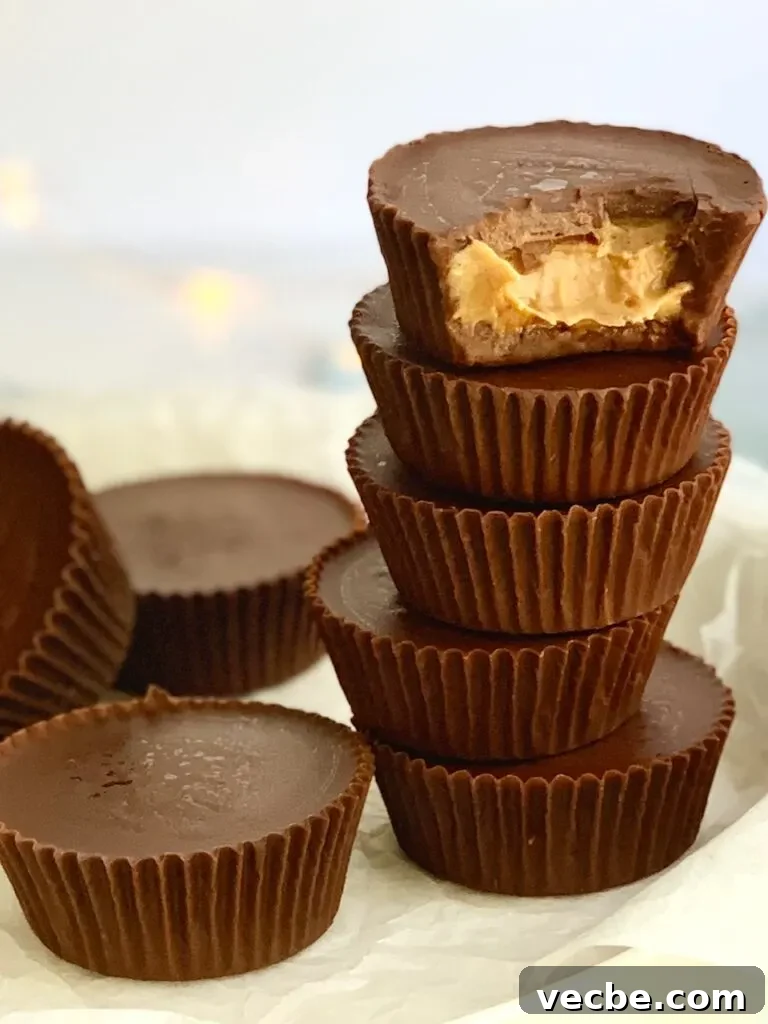 Romantic Valentine's Day Recipes for Two 14 a plate of stacked peanut butter cups and a bite missing out of the top cup. You can see peanut butter.