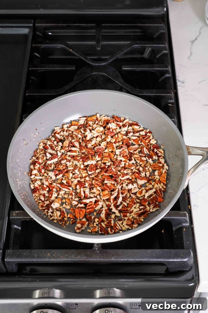 Mini Pecan Pie Cheesecake Bites Recipe 14 Pecans are dry toasted in a sauté pan over the stove.