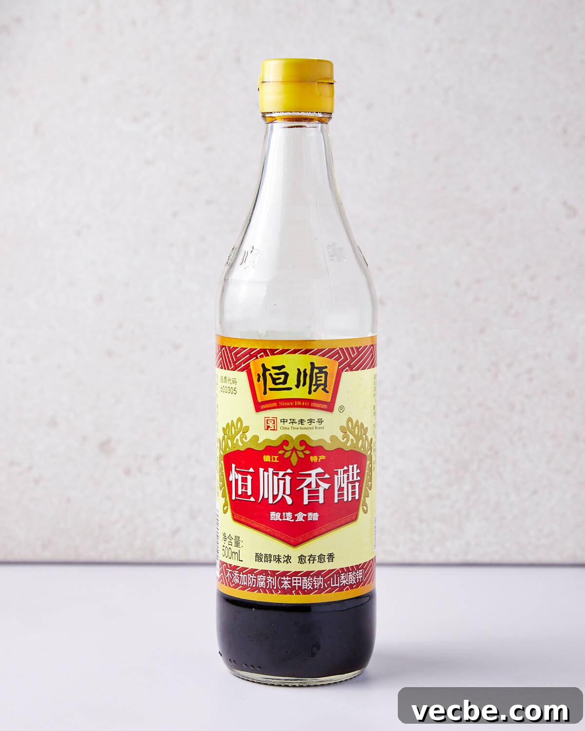 Quick Chinese Pickled Cucumbers Recipe 3 Photo of a bottle of gluten-free chinese black vinegar on a plain background.