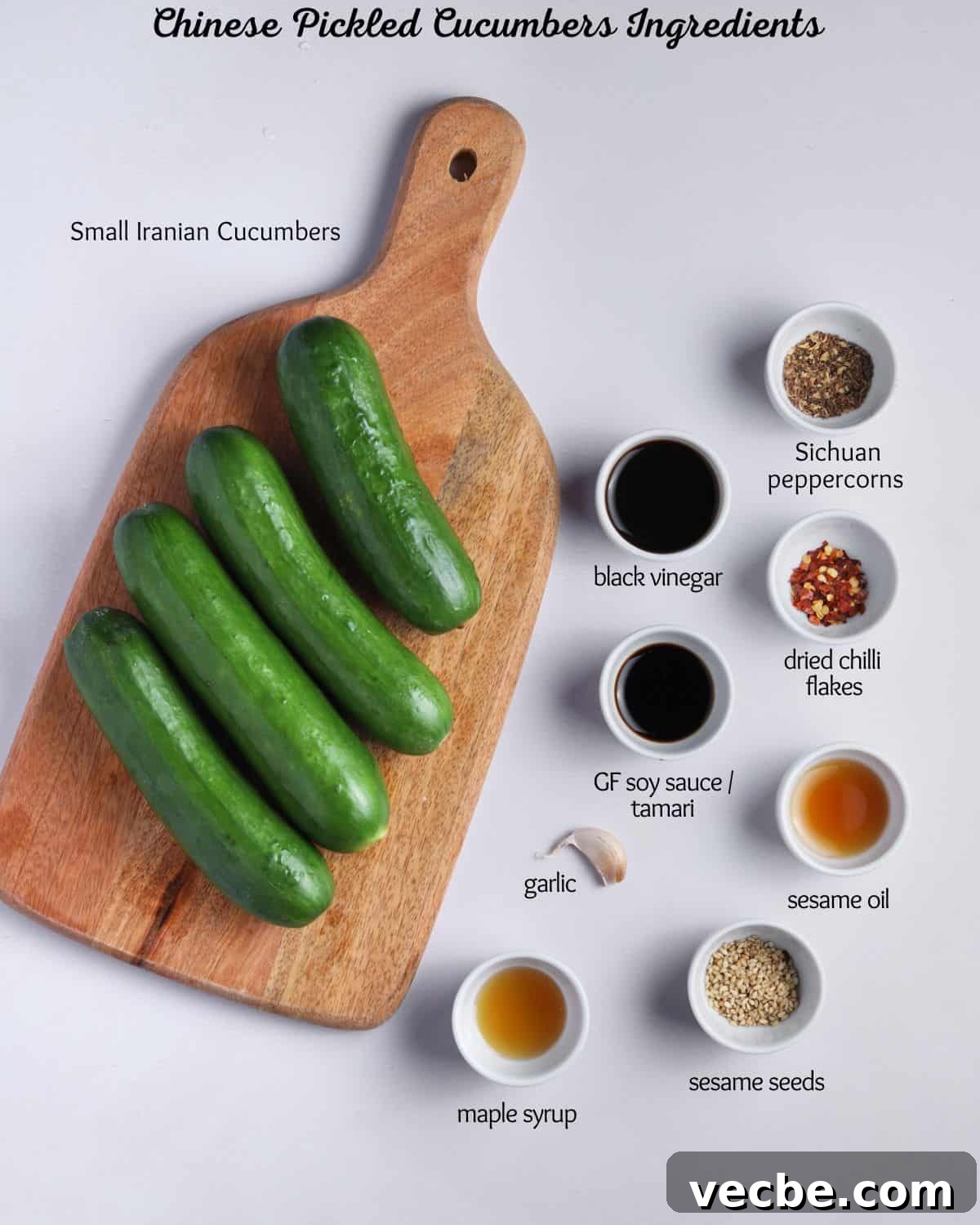 Quick Chinese Pickled Cucumbers Recipe 4 Photo showing the ingredients needed to make Chinese quick pickled cucumbers, all laid out in little dishes and labelled.