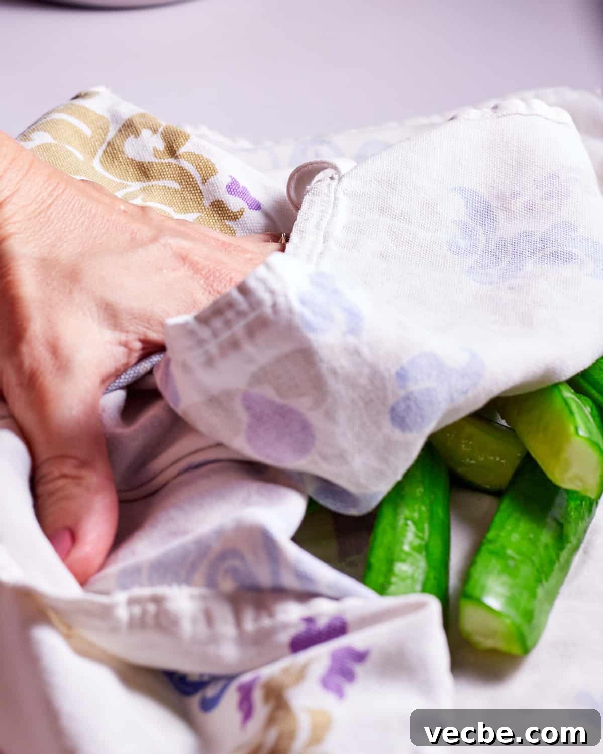 Quick Chinese Pickled Cucumbers Recipe 7 Photo of cucumbers being dried in a tea towel.
