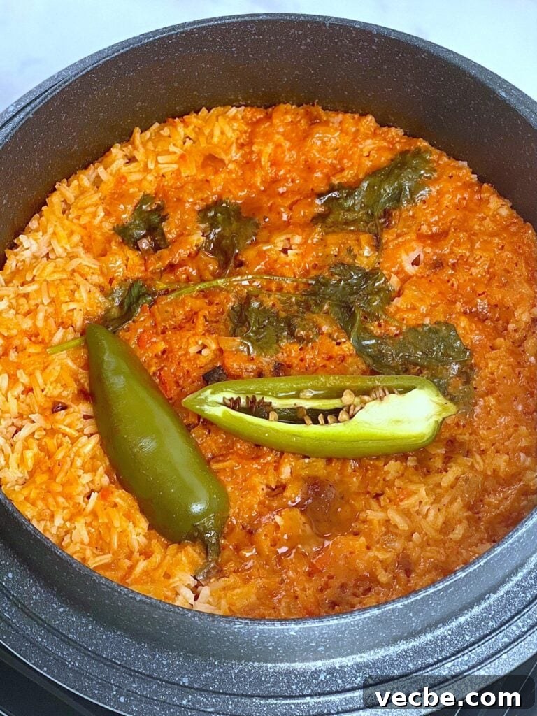 Arroz Rojo: Authentic Mexican Red Rice Recipe 3 Rice being prepared