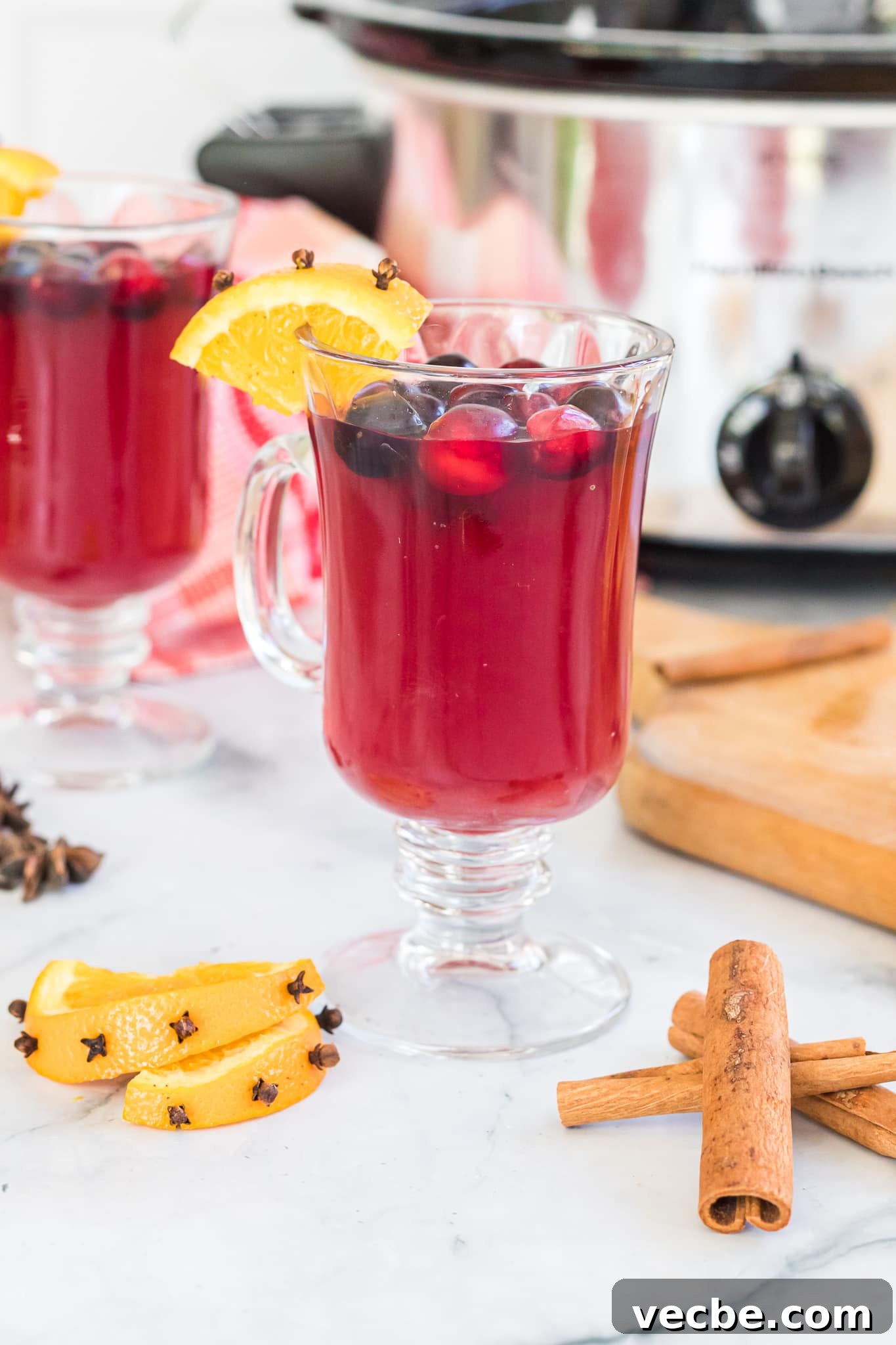 Slow Cooker Spiked Wassail: Festive Mulled Cider 3 slow cooker wassail in a cup