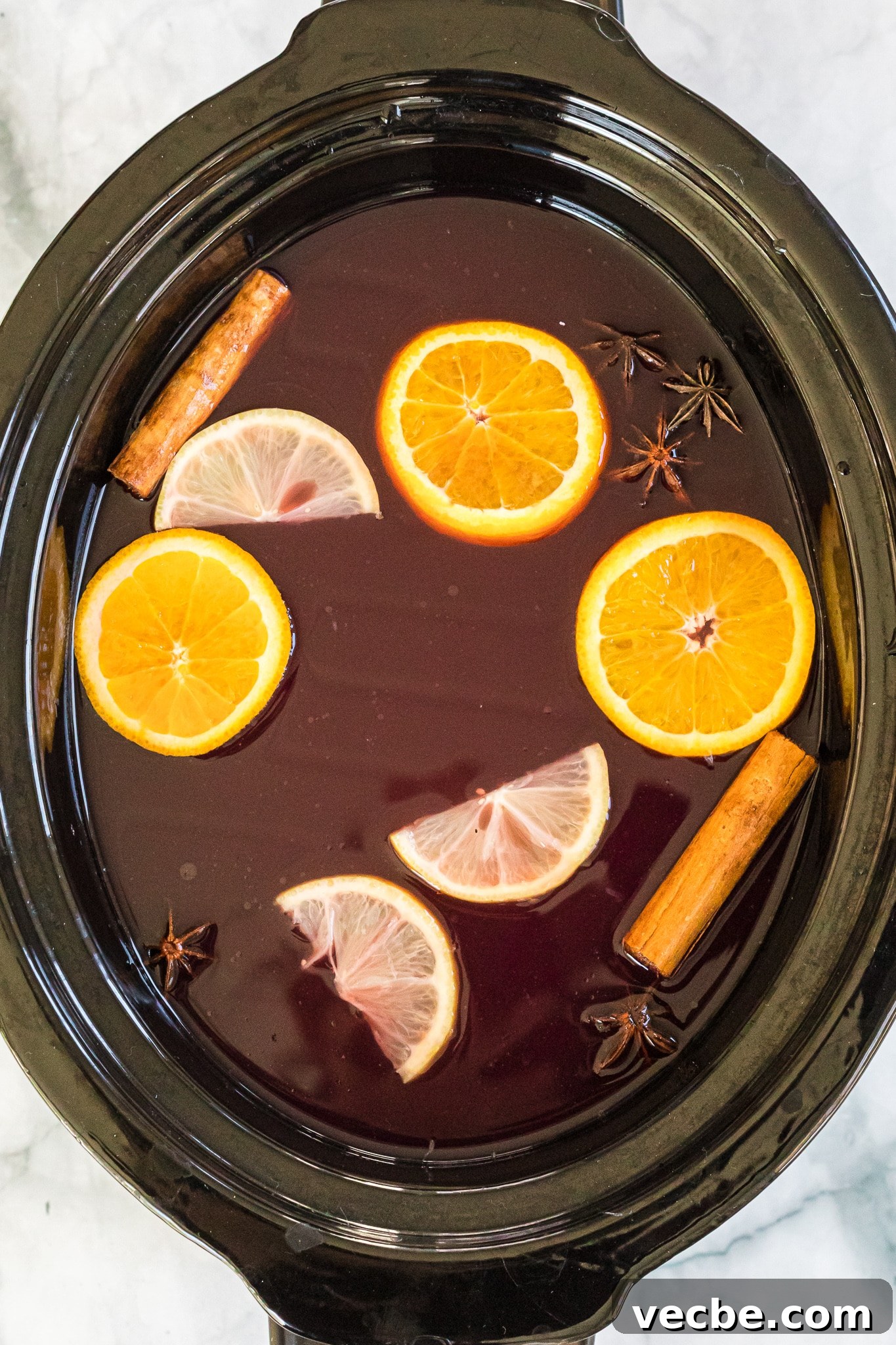 Slow Cooker Spiked Wassail: Festive Mulled Cider 6 wassail in a slow cooker