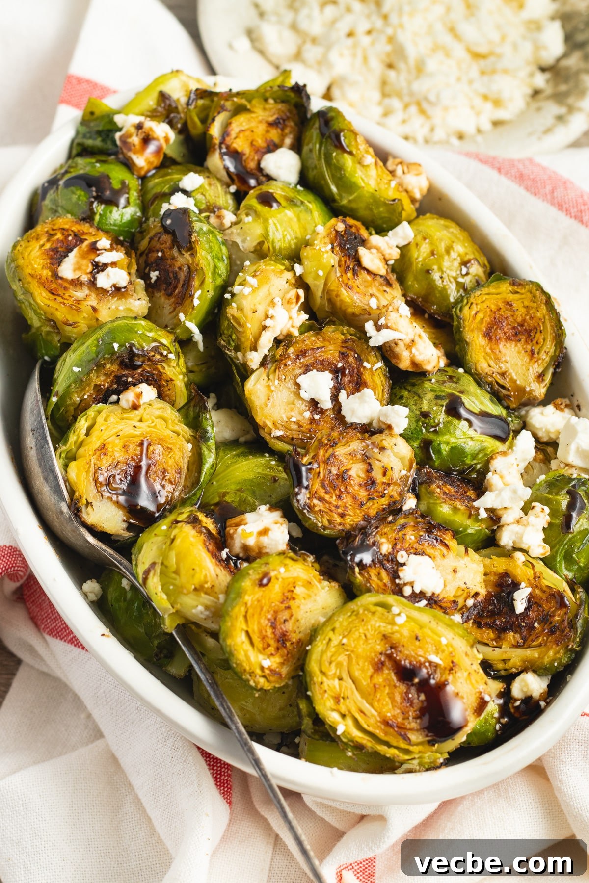 Crispy Oven-Roasted Brussels Sprouts with Feta 2 This is a picture of a bowl of Brussels sprouts with feta and balsamic glaze.