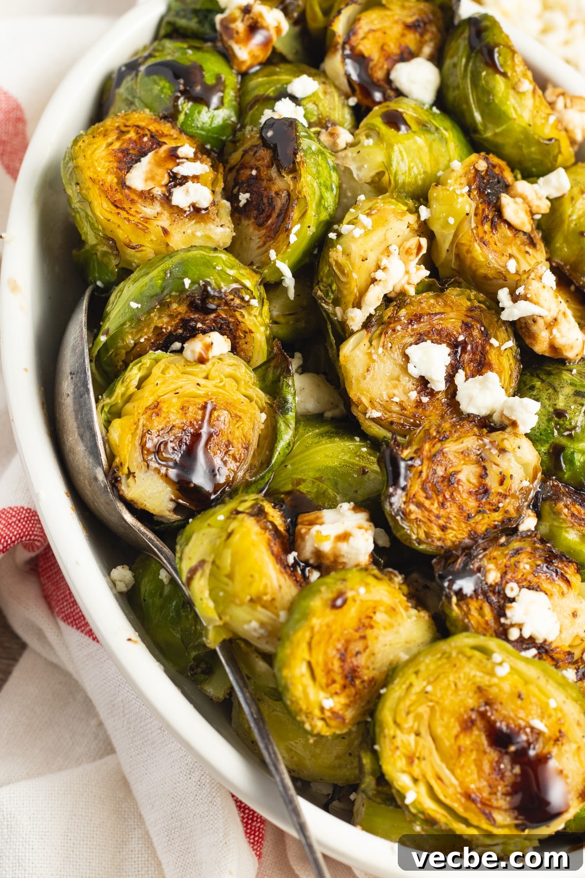 Crispy Oven-Roasted Brussels Sprouts with Feta 14 This is a picture of a bowl of Brussels sprouts with feta and balsamic glaze.