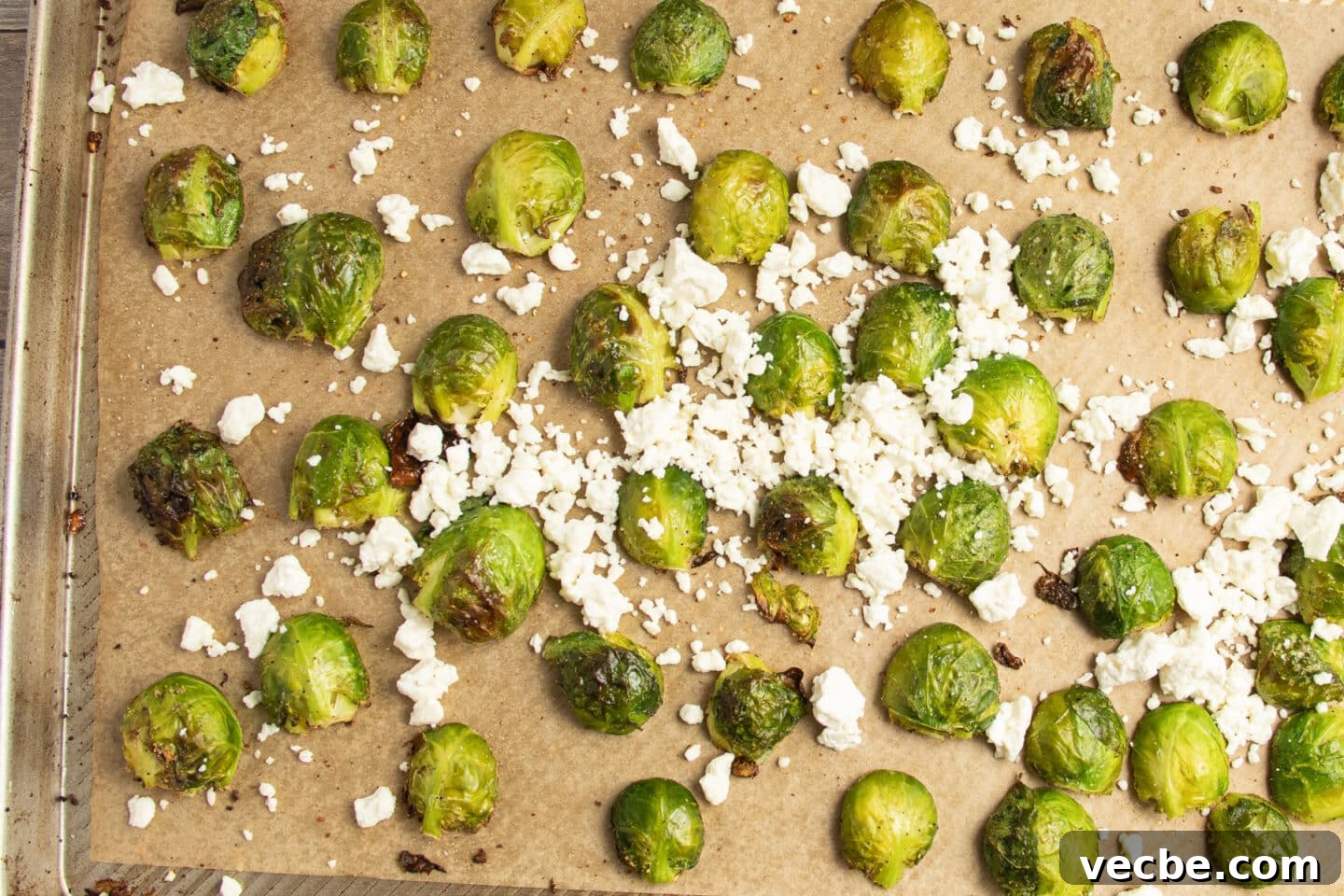 Crispy Oven-Roasted Brussels Sprouts with Feta 9 This is a picture of a baking sheet of Brussels sprouts with added feta.