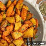 This is a picture of a plate with air fryer carrots and potatoes.