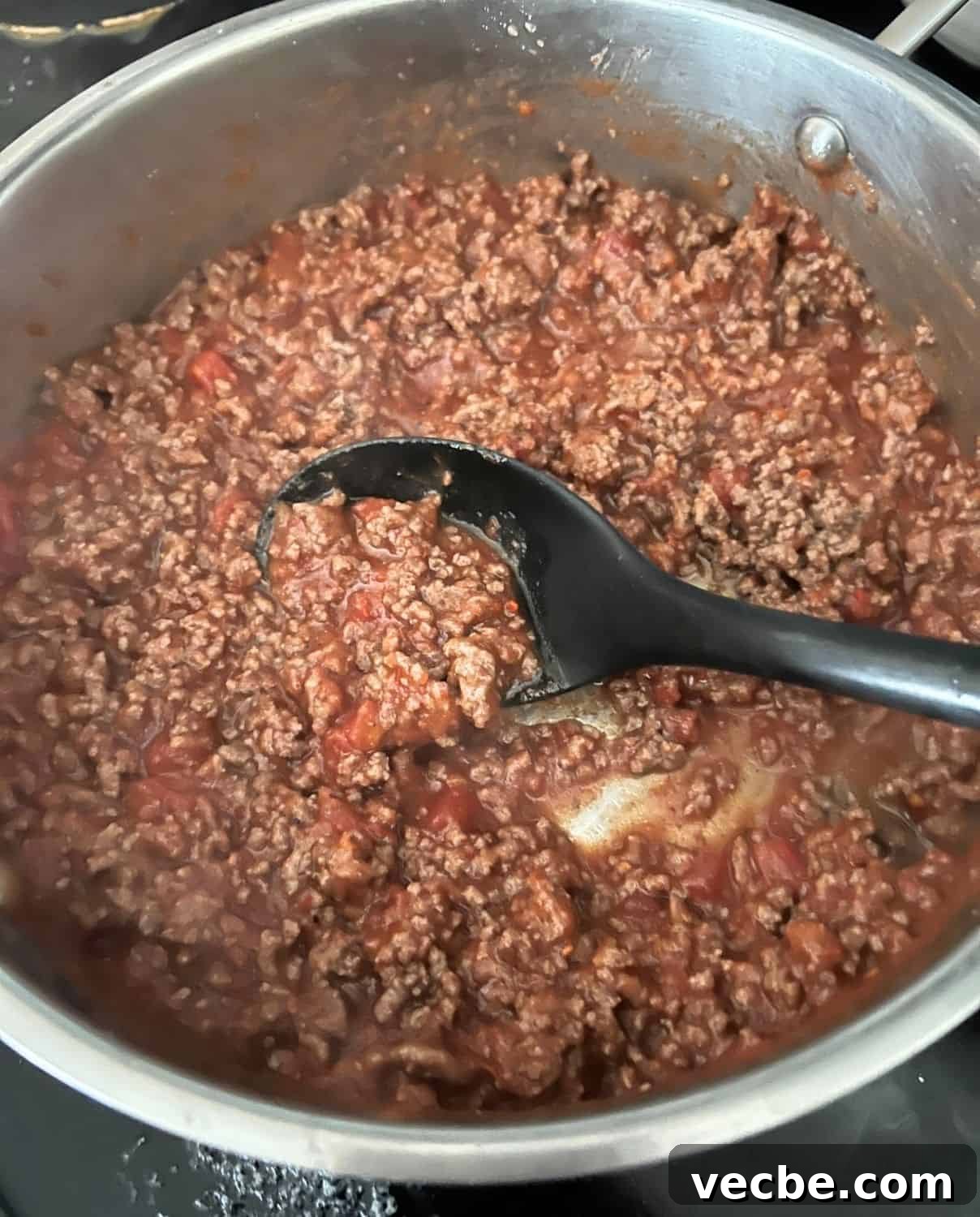 Chicago-Style Deep-Dish Pizza Casserole Recipe 4 Cooked ground beef and sauce in a skillet.
