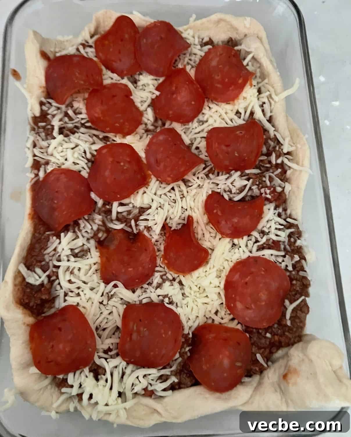 Chicago-Style Deep-Dish Pizza Casserole Recipe 6 Cheese and pepperoni on top of pizza casserole.