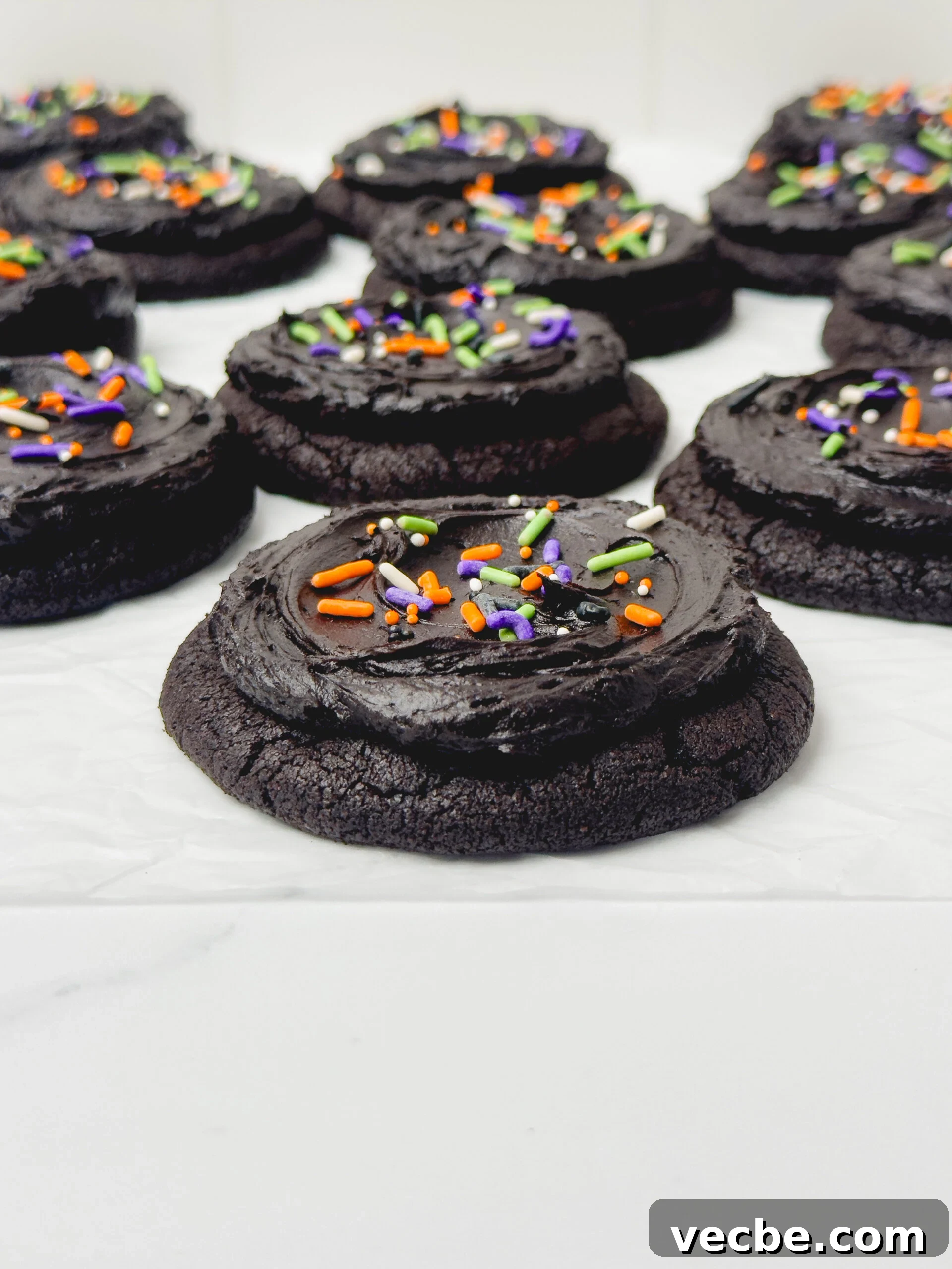 Frosted Black Cocoa Cookies Recipe 3 Black cocoa powder cookies close up